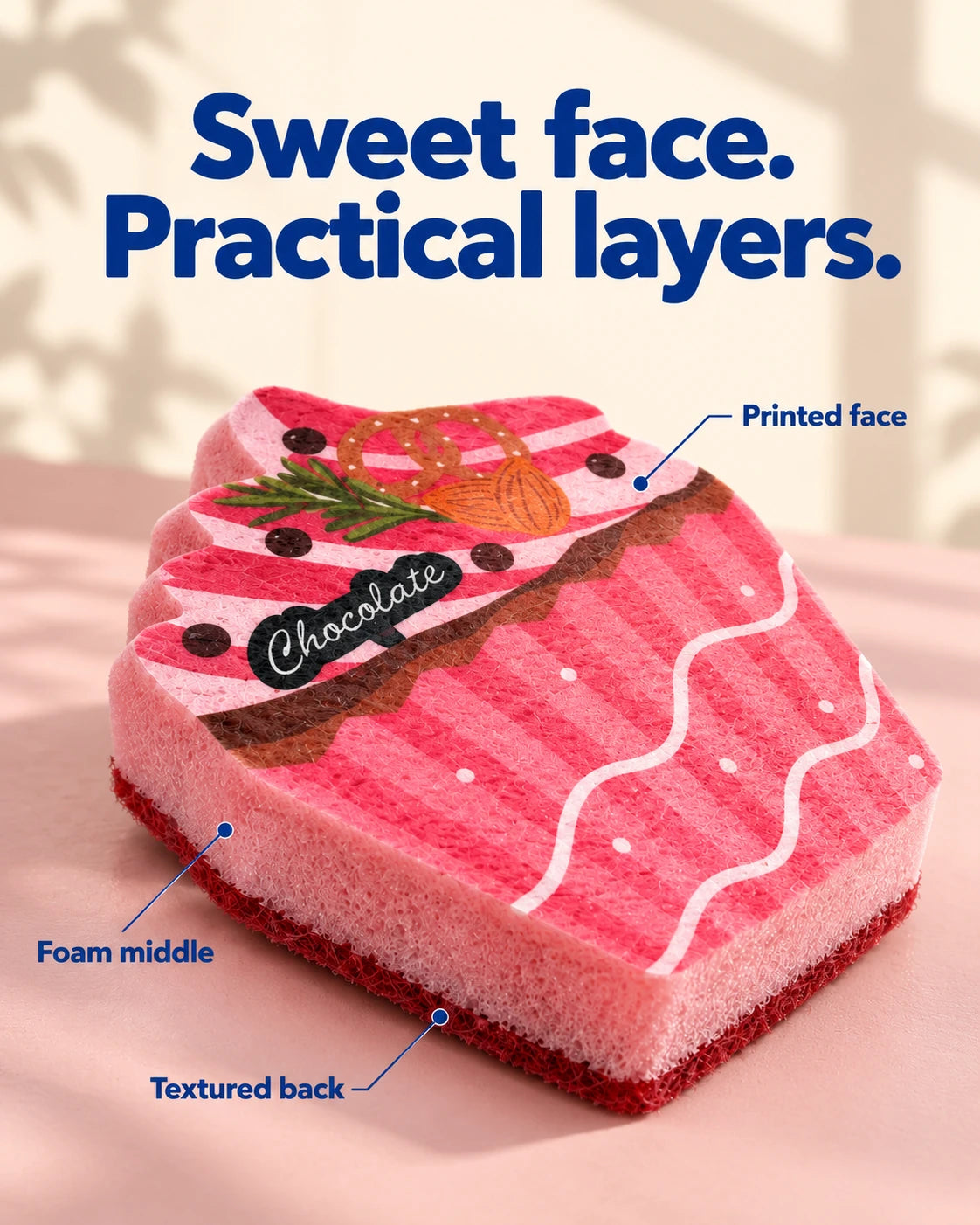 Close-up of the pink cupcake sponge showing the printed face, foam middle and separate red textured backing.