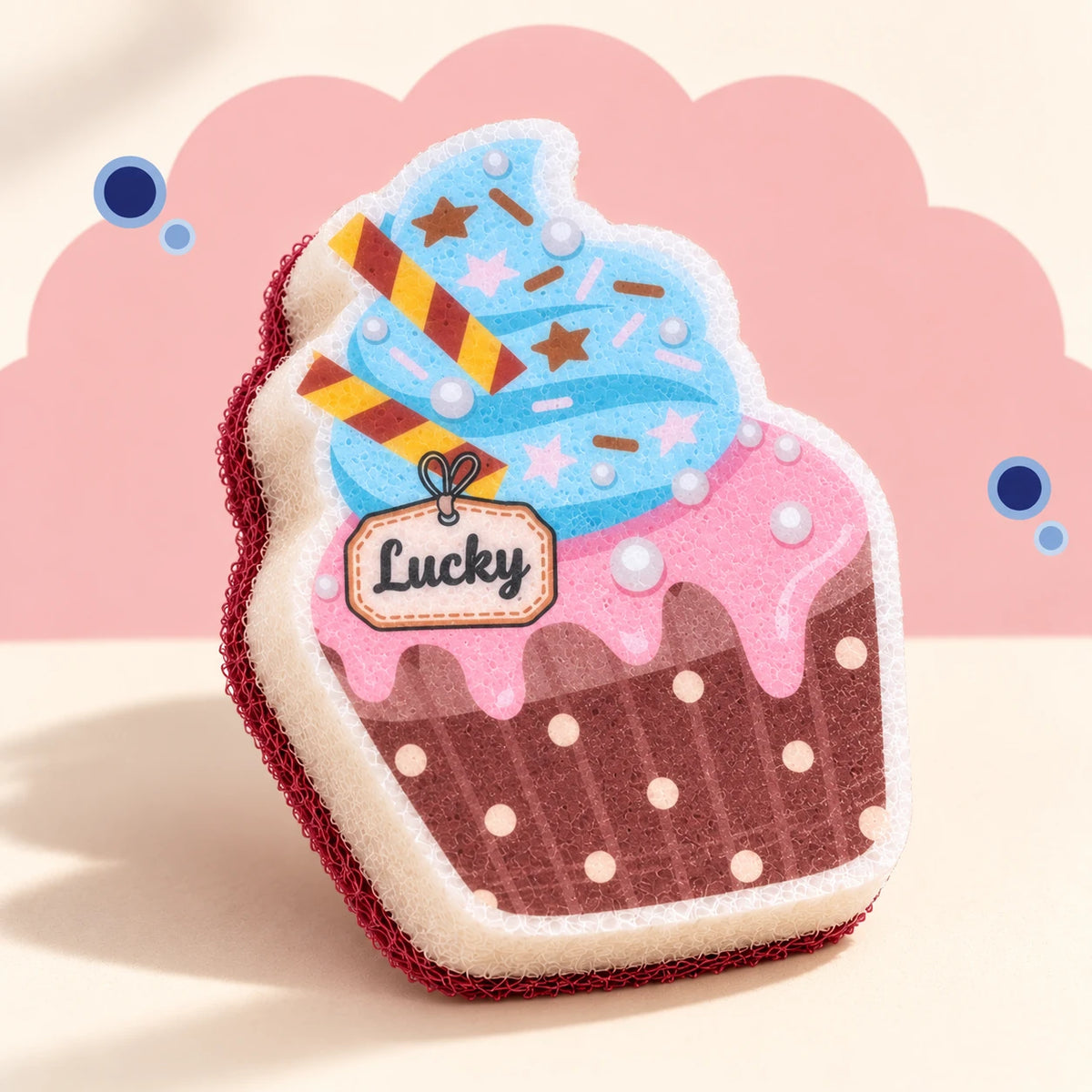 Blue & Brown Cupcake cleaning sponge with flat swirl and Lucky artwork, cream body, and burgundy cleaning back.