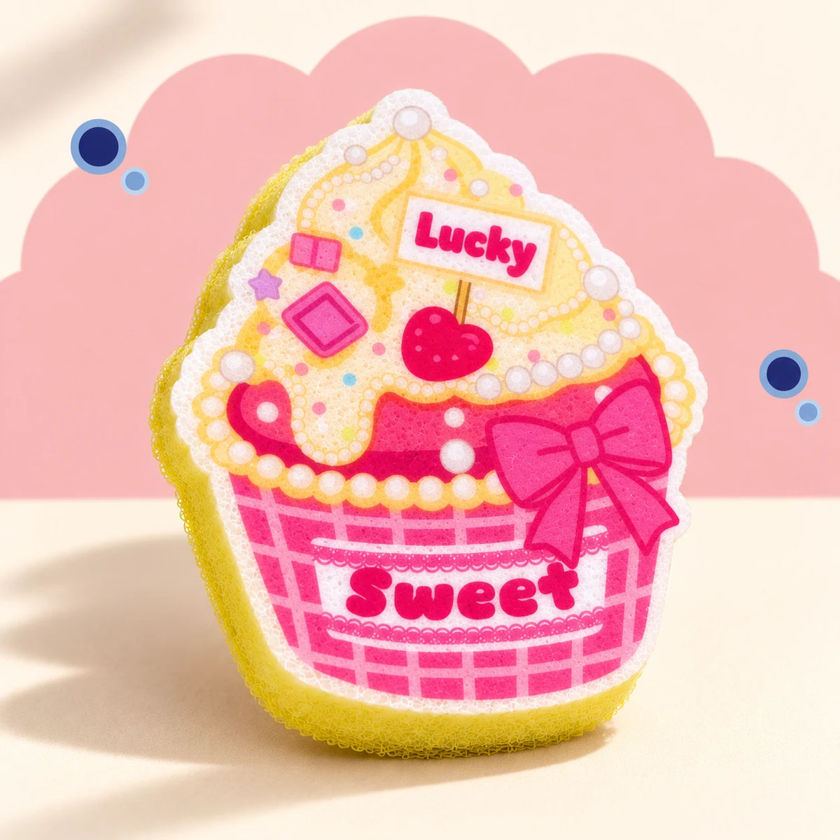 Pink & Yellow Cupcake cleaning sponge with flat Lucky and Sweet artwork, pink grid wrapper, and yellow foam body.
